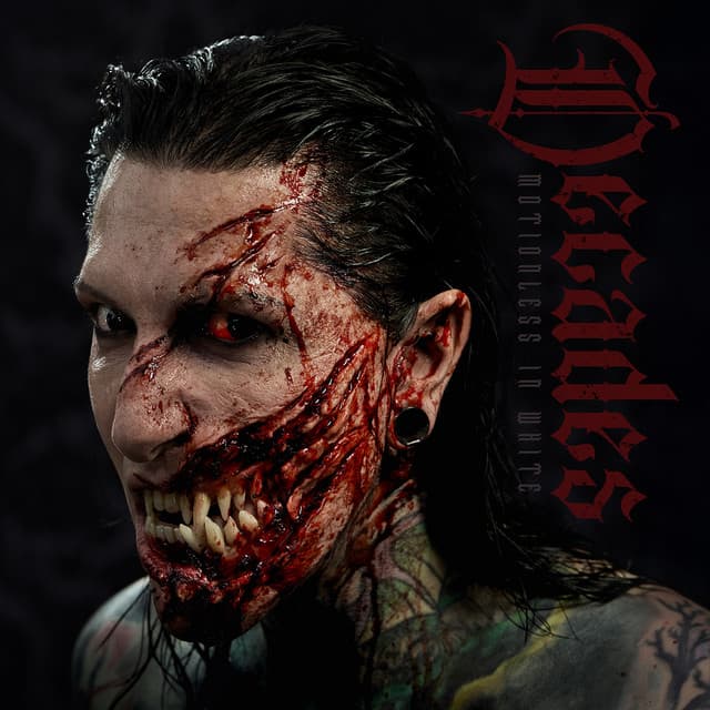 Album cover featuring a person with graphic horror makeup showing exposed teeth and bloody wounds, with "Decades" in red gothic text.